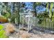 Landscaped backyard featuring a decorative pergola, rocks and mature trees at 10715 Hamilton Pass, Fishers, IN 46037