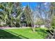 Spacious backyard featuring lush green grass and a beautiful metal gazebo, perfect for outdoor relaxation and entertaining at 10715 Hamilton Pass, Fishers, IN 46037