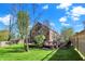 Backyard view of a house with a deck and a basketball court at 10715 Hamilton Pass, Fishers, IN 46037