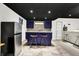 Contemporary basement bar featuring an island with seating and stainless steel fridge at 10715 Hamilton Pass, Fishers, IN 46037