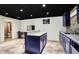Basement bar featuring granite counters, an island, and an adjacent bathroom at 10715 Hamilton Pass, Fishers, IN 46037