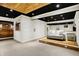 Finished basement featuring wooden ceilings, wood stage with a couch at 10715 Hamilton Pass, Fishers, IN 46037