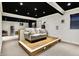 Finished basement showcasing a couch on a stage, and a snack area at 10715 Hamilton Pass, Fishers, IN 46037