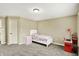 Cozy bedroom with carpet floors, a playful decor, and ample natural light at 10715 Hamilton Pass, Fishers, IN 46037
