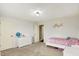 Neutral bedroom featuring white walls, a single bed, and a dresser with a globe at 10715 Hamilton Pass, Fishers, IN 46037