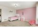 Bright bedroom featuring a white single bed, pink accents, and neutral carpet at 10715 Hamilton Pass, Fishers, IN 46037