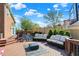 Outdoor deck with seating and a basketball hoop overlooking manicured landscaping, providing an ideal space for outdoor activities at 10715 Hamilton Pass, Fishers, IN 46037