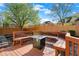 Cozy backyard deck featuring a fire pit and built-in benches, creating a perfect space for outdoor gatherings at 10715 Hamilton Pass, Fishers, IN 46037
