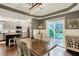 The dining area is steps from the kitchen and offers deck access through the sliding doors at 10715 Hamilton Pass, Fishers, IN 46037