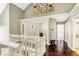 Second floor hallway with dark hardwood floors and white railings at 10715 Hamilton Pass, Fishers, IN 46037