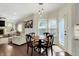 Charming kitchen and living space, wood table and chairs near window with natural light at 10715 Hamilton Pass, Fishers, IN 46037