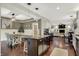 Open concept living space with kitchen, dining area, and living room on hardwood floors at 10715 Hamilton Pass, Fishers, IN 46037