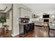 Open-concept living space with bar area, fireplace, and comfortable seating arrangement at 10715 Hamilton Pass, Fishers, IN 46037