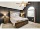 Spacious main bedroom with vaulted ceiling, dark accent walls, and elegant furnishings at 10715 Hamilton Pass, Fishers, IN 46037
