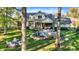 Expansive backyard with a fire pit, outdoor seating, and well-maintained landscaping at 10725 Holliday Farms Blvd, Zionsville, IN 46077