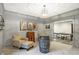 Finished basement area with comfortable seating and a ping pong table in the background at 10725 Holliday Farms Blvd, Zionsville, IN 46077