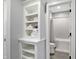 Bathroom with built-in shelves and a view into the shower/tub area at 10725 Holliday Farms Blvd, Zionsville, IN 46077