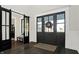 Elegant entryway featuring dark wood floors, stylish doors, and decorative accents at 10725 Holliday Farms Blvd, Zionsville, IN 46077