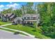 Picturesque two-story home with lush greenery, sidewalk access, and neighborhood charm at 10725 Holliday Farms Blvd, Zionsville, IN 46077