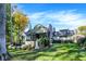 Beautiful home exterior with manicured lawn, landscape design and backyard outdoor living space at 10725 Holliday Farms Blvd, Zionsville, IN 46077