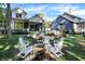 Beautiful backyard fire pit with Adirondack chairs and custom landscaping, perfect for entertaining guests at 10725 Holliday Farms Blvd, Zionsville, IN 46077
