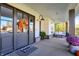 Inviting front porch with comfortable seating, stylish decor, and charming details at 10725 Holliday Farms Blvd, Zionsville, IN 46077