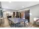 Spacious game room with a ping pong table, foosball table, and a nearby kitchenette at 10725 Holliday Farms Blvd, Zionsville, IN 46077