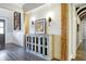 Stylish hallway with a decorative cabinet, sconces, and wood accents, creating a sophisticated look at 10725 Holliday Farms Blvd, Zionsville, IN 46077