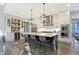 Spacious kitchen with stainless steel appliances and dark wood island with seating at 10725 Holliday Farms Blvd, Zionsville, IN 46077