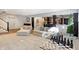 This living room features a chess set, a Christmas tree, modern couches, and access to a dining area at 10725 Holliday Farms Blvd, Zionsville, IN 46077