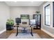 Modern home office with a sleek desk, built-in shelving, and abundant natural light at 10725 Holliday Farms Blvd, Zionsville, IN 46077