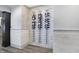 Modern wine storage and display area with decorative wall and flooring at 10725 Holliday Farms Blvd, Zionsville, IN 46077