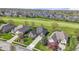 Aerial view showcasing the house surrounded by lush landscaping, and neighboring homes in a well-maintained community at 10911 Innisbrooke Ln, Fishers, IN 46037