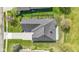 Aerial, top down shot showing roof, driveway and landscaping of the property at 10911 Innisbrooke Ln, Fishers, IN 46037