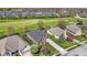 Aerial view of a home surrounded by lush greenery, near golf course, showcasing its serene location in a friendly neighborhood at 10911 Innisbrooke Ln, Fishers, IN 46037