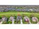 Aerial view showcasing house nestled among other properties in a lush green neighborhood with tree-lined streets at 10911 Innisbrooke Ln, Fishers, IN 46037