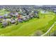 Expansive aerial view of home with golf course, pond, and mature landscaping in a desirable neighborhood at 10911 Innisbrooke Ln, Fishers, IN 46037