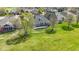 Aerial view of home and back yard with deck overlooking an expansive green lawn at 10911 Innisbrooke Ln, Fishers, IN 46037