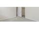 Bright bedroom with neutral walls, plush carpeting, and closet with open door for easy access at 10911 Innisbrooke Ln, Fishers, IN 46037