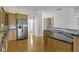 Kitchen area showcasing the stainless steel refrigerator and island at 10911 Innisbrooke Ln, Fishers, IN 46037