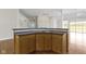 Kitchen island featuring granite countertops and wood cabinetry at 10911 Innisbrooke Ln, Fishers, IN 46037