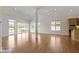 Spacious living room with hardwood floors, fireplace, and natural light at 10911 Innisbrooke Ln, Fishers, IN 46037