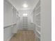 Walk-in closet with custom shelving and ample storage space at 10911 Innisbrooke Ln, Fishers, IN 46037
