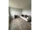 Comfortable living room area features wood-look floors and a cozy sofa at 10931 N Longbranch St, Monrovia, IN 46157
