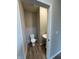 Charming powder room featuring a toilet and pedestal sink, perfect for guests at 10931 N Longbranch St, Monrovia, IN 46157