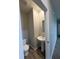 Bright powder room with pedestal sink and toilet at 10931 N Longbranch St, Monrovia, IN 46157
