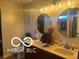 This bathroom features a double vanity, matching mirrors and great lighting at 11555 Ross Common Dr, Indianapolis, IN 46229