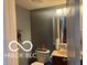Half bathroom with vanity and mirror at 11555 Ross Common Dr, Indianapolis, IN 46229