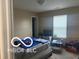 This bedroom features a twin bed, a window and a TV at 11555 Ross Common Dr, Indianapolis, IN 46229
