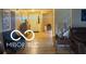 Inviting entryway with hardwood floors and a view of the staircase at 11555 Ross Common Dr, Indianapolis, IN 46229